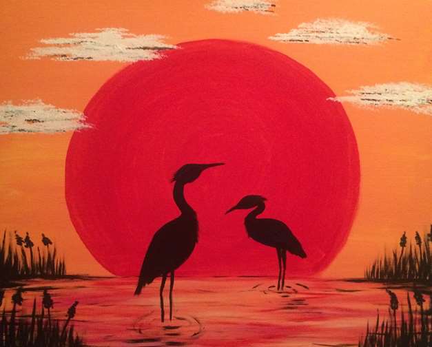 Blue Herons and the Red Sun
